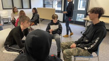 Hawk Cousins Mentorship Program 2023 Group of 4 male students sitting in chairs in a circle